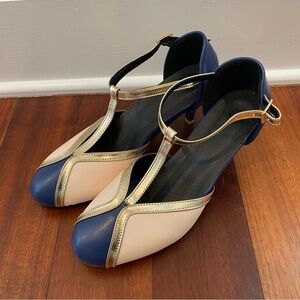 Classic Two-Tone T-Strap Pumps in Navy and Cream with Gold Trim